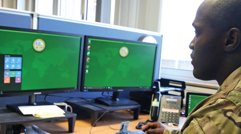 .S. Army Staff Sgt. Johnnie Robinson, 2nd Theater Signal Brigade command group noncommissioned officer, uses a government computer with Microsoft Windows 10 operating system, Oct. 2, 2017 in Wiesbaden, Germany.